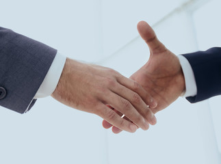 Two  business men going to make handshake
