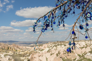 a tree hung with evil eyes in the volcanic sculpted region of Cappadocia