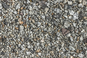background texture. small gray pebbles on the ground.