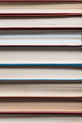 Many books in a bookstore or library on wooden background with copy space