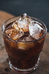 close up view of glass of cold brewed coffee with ice cubes