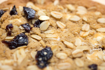 Oat cookie halves on wooden surface
