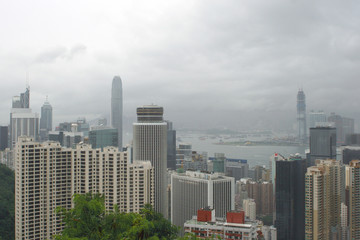 Hong Kong: View from Stubbs Road Lookout across Hong Kong Central to the opposite mainland with a construction site on a rainy summer day