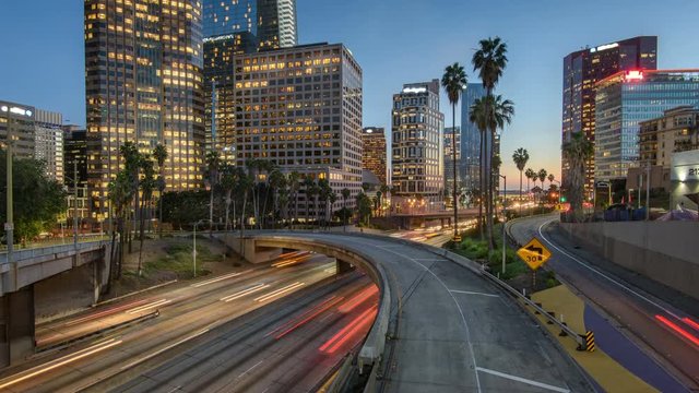 Time lapse freeway traffic in downtown Los Angeles at sunset