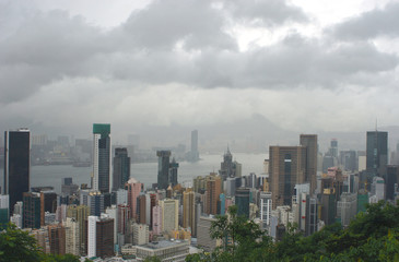 Fototapeta na wymiar Hong Kong: View from Stubbs Road Lookout across Wan Chai to the opposite mainland on a rainy summer day