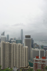 Fototapeta premium Hong Kong: View from Stubbs Road Lookout across Wan chai and Hong Kong Central on a rainy summer day