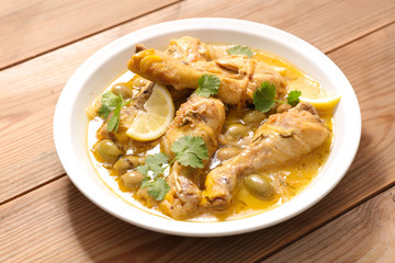 chicken leg cooked with olive, coriander and lemon