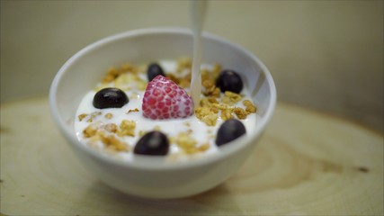 Milk with berries. The berries are filled with milk.