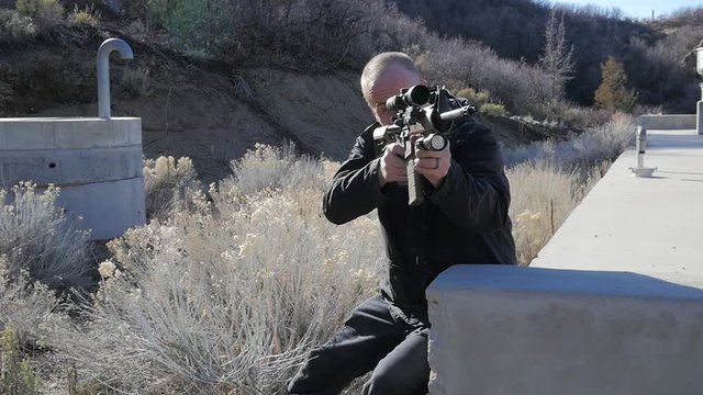 Man with a scary military style assault weopon.