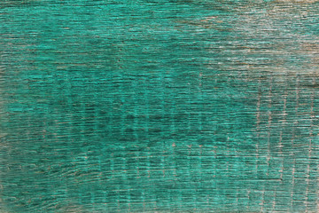 Texture of an old wooden painted green paint board for the background.