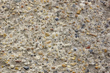 stone and cement texture background. small river stones with cement for sidewalks
