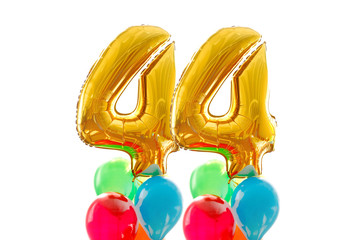 Golden number 44 forty four made of inflatable balloon colored balloons white background