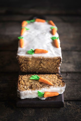 Carrot cake sliced and on the wooden board,selective focus