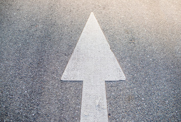 arrow marking pointing ahead on road surface