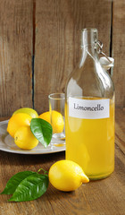 Italian alcoholic beverage, Limoncello on wooden table