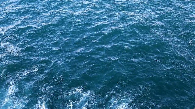 Waves on the Sea. Top view of the Sea surface. Beautiful deep blue Ocean Water abstract background.