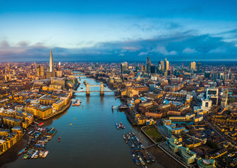 London, England - Panoramic aerial skyline view of London including Tower Bridge with red...