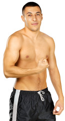 Fototapeta premium Topless young man bodybuilder posing isolated on white background