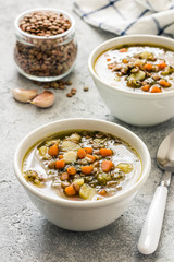 Golden cococnut lentil spinach soup. Selective focus, space for text. 