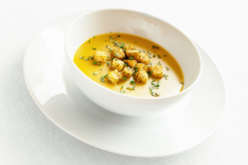 soup puree with croutons and herbs 
