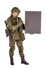 russian special forces soldier with rifle on dark background. army, military and people concept