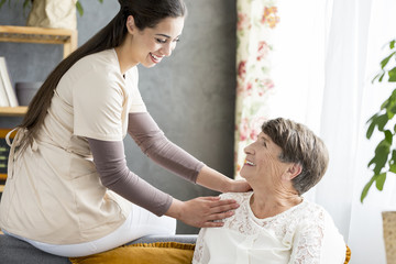 Nurse touching shoulder of patient