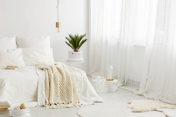 Fototapeta na wymiar Cozy bedroom with white bedding