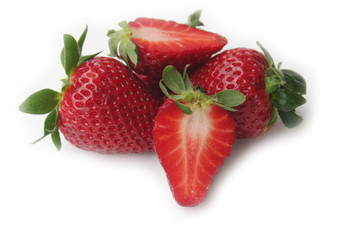 Whole and half strawberries isolated on white background