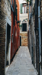 Narrow claustrofobic alley in Venice, Italy