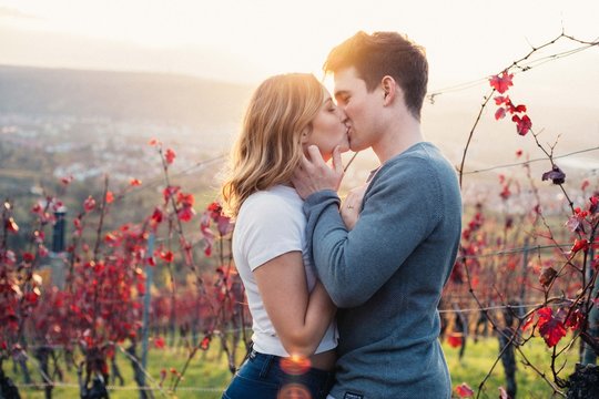 Couple kissing in field