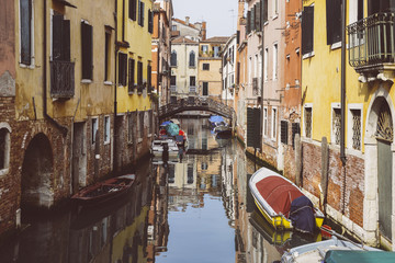 Fototapeta na wymiar Colorful bridge across canal in Venice, Italy.