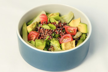 Fresh Avocado tomato and arugula salad healthy vegan food