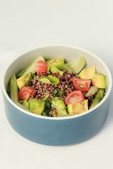 Fresh Avocado tomato and arugula salad healthy vegan food