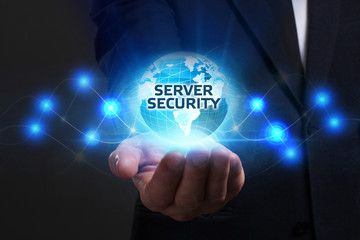 Business, Technology, Internet and network concept. Young businessman working on a virtual screen of the future and sees the inscription: Server security