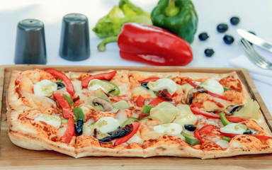 Margherita italian pizza with melted mozzarella cheese and tomato garnished with fresh basil