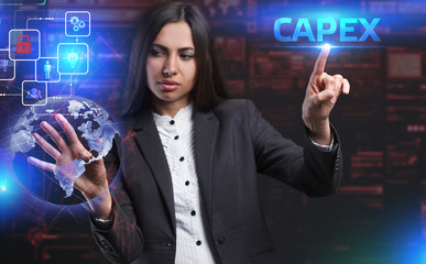 The concept of business, technology, the Internet and the network. A young entrepreneur working on a virtual screen of the future and sees the inscription: Capex