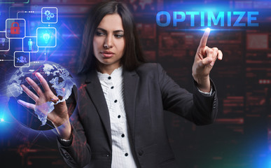 The concept of business, technology, the Internet and the network. A young entrepreneur working on a virtual screen of the future and sees the inscription: Optimize