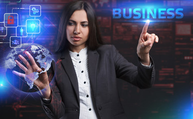 The concept of business, technology, the Internet and the network. A young entrepreneur working on a virtual screen of the future and sees the inscription: Business