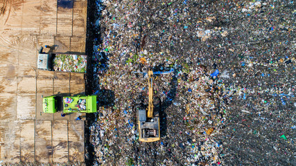 A lot of waste is disposed of in the waste disposal pits. Makro is working on a mountain garbage. Aerial view and top view.