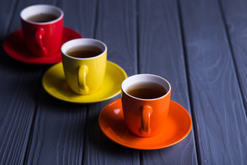 colored cups with coffee