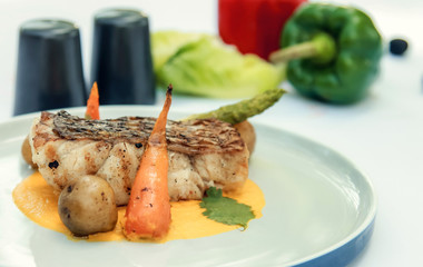 Grilled fish fillet with vegetables