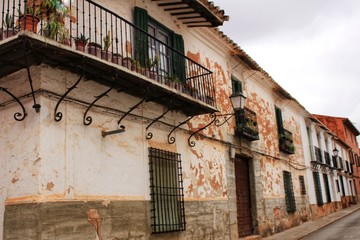 Old facades, balconies and vintage lanterns in Villanueva de los Infantes, Spain