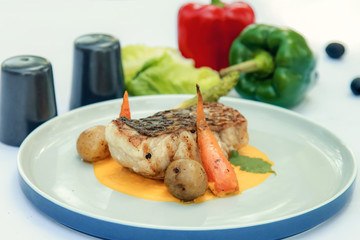 Grilled fish fillet with vegetables