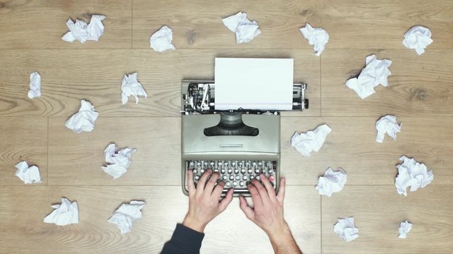 Book author's frustration, angry writer on a vintage typewriter. 4k video black and white and colors