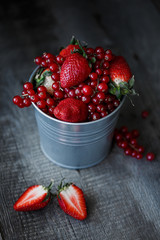 Concept of red berries on wooden board