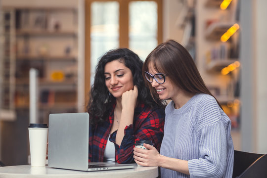 Smiling women with laptop