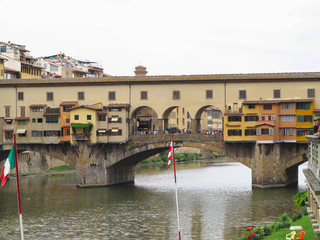 Fototapeta na wymiar 14.06.2017 Florence, Italy: View of medieval stone bridge Ponte Vecchio and Arno River