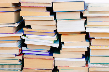 Stack of books background. many books piles.