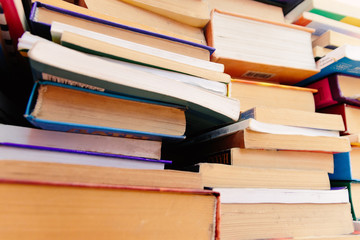 Stack of books background. many books piles.