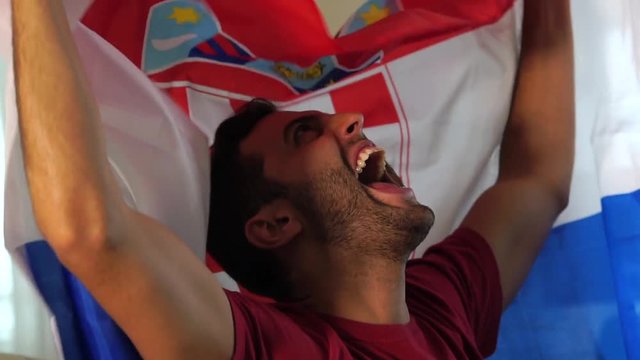 Croatian fan celebrating with flag